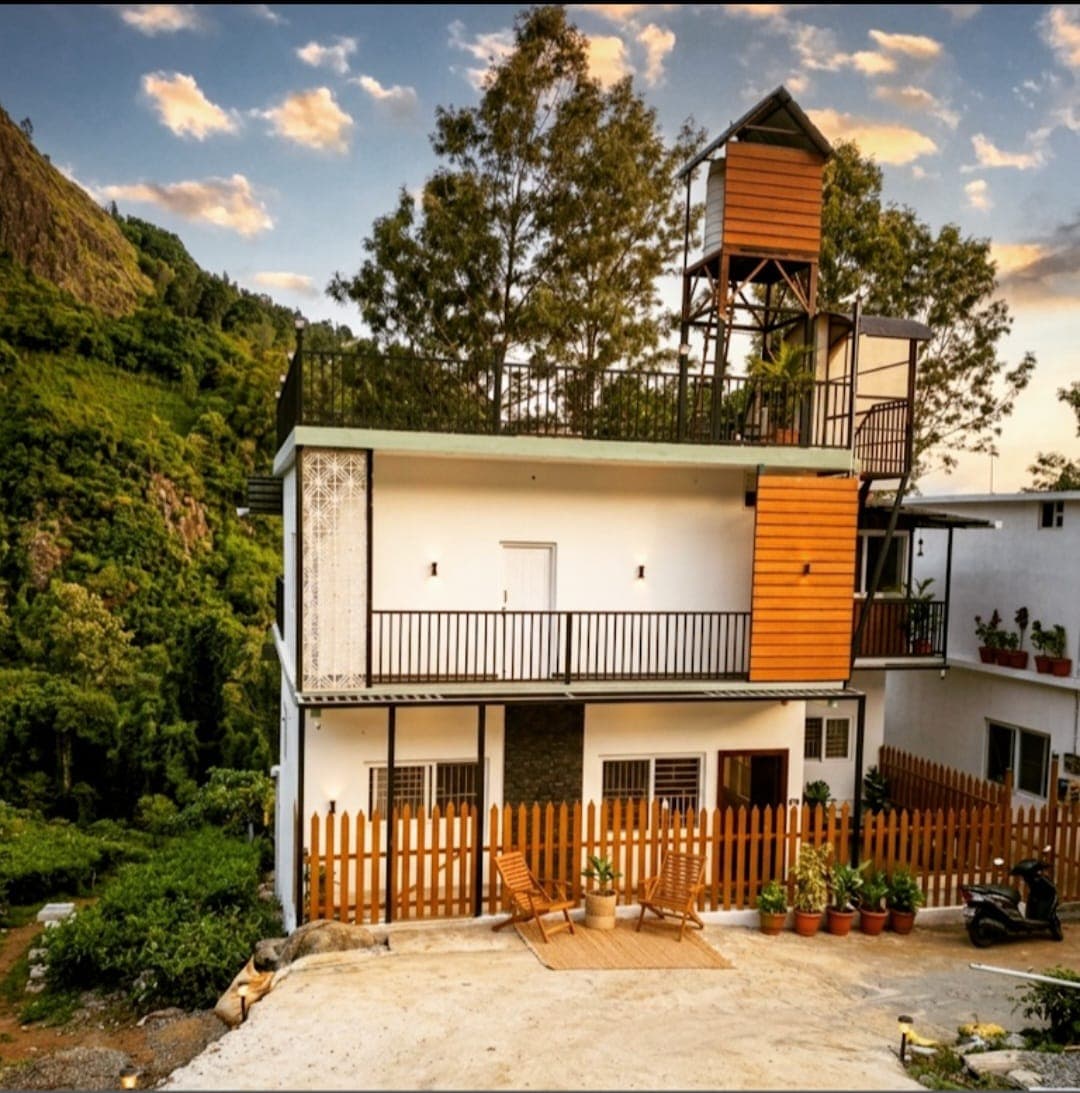 SpringNest Stays framed by the Coonoor hillside